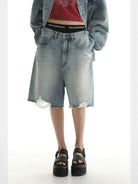 MASONPRINCE Light Wash Raw Hem Denim Shorts in Blue - On Female Model