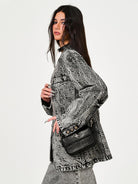 SMFK Small Leather Badge Chain Crossbody in Black - On Female Model