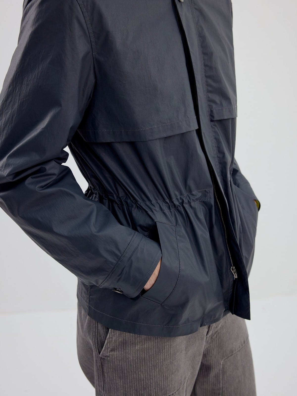 SIMPLE PROJECT Coated Drawstring Hunting Jacket in Gray - On Model