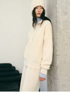 TEASEL Merino Wool Boucl Zip Cardigan in White - On Female Model