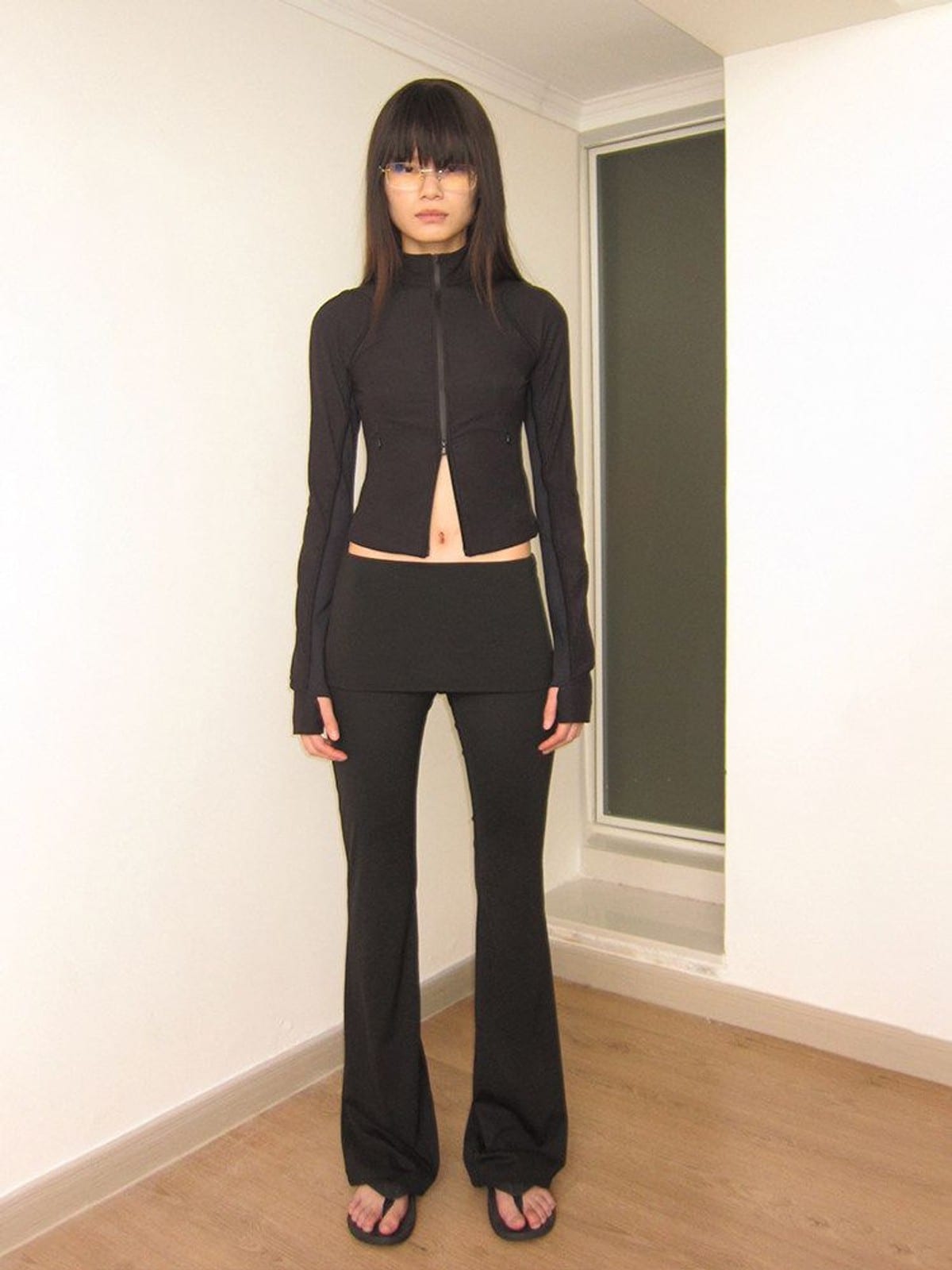 RARELY ALIKE Low Rise Layered Flared Yoga Pants in Black - On Female Model