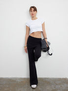 MADEINAM Fold Over Waist Flared Stretch Pants in Black - On Female Model