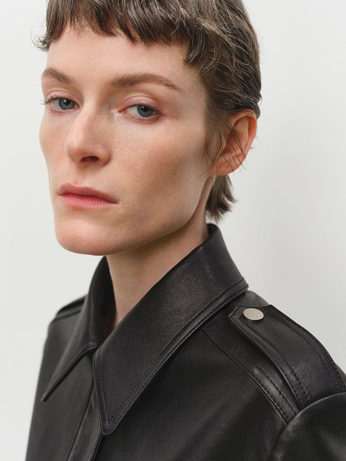 MSBEAST Cropped Sheepskin Moto Jacket in Black - On Female Model