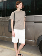 RARELY ALIKE Tailored Bermuda Shorts in White - On Female Model