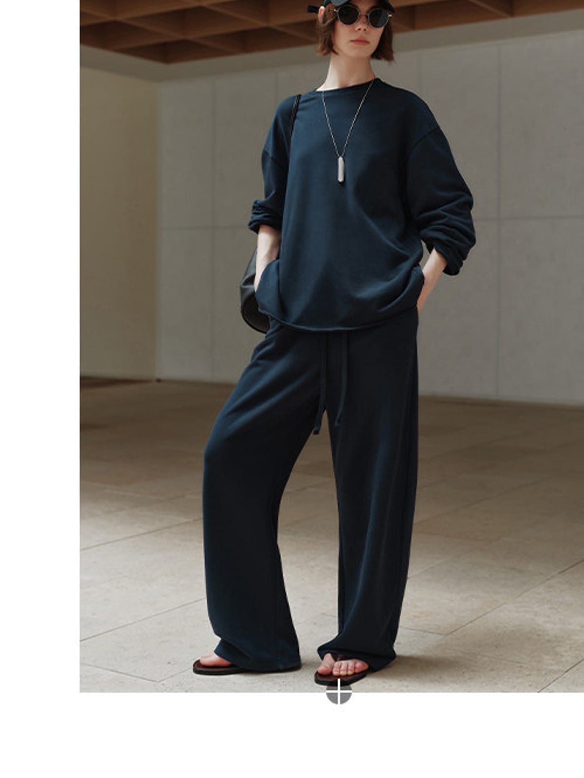 MSBEAST Cotton Terry Sweatshirt Tapered Joggers in Navy Blue - On Female Model