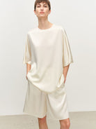 MSBEAST Oversized Acetate Satin T Shirt in White - On Female Model