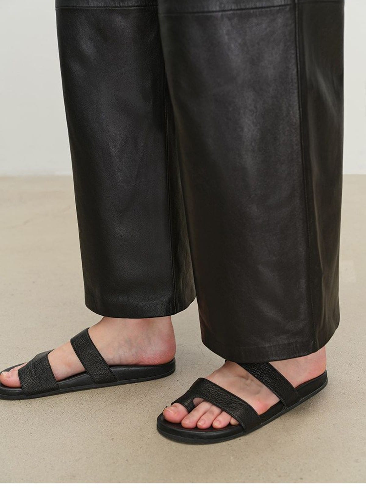 MSBEAST Cropped Wide Leg Leather Trousers in Black - On Model