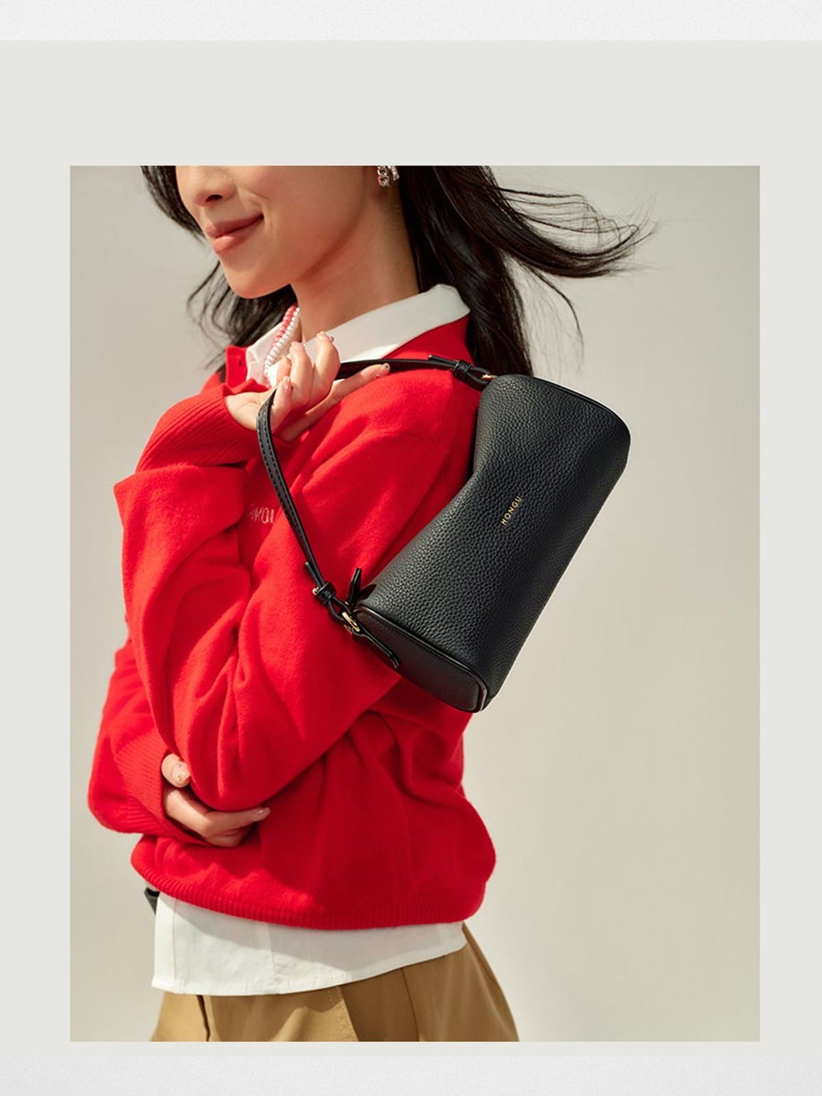 HONGU Leather Crossbody Pillow Bag in Black - On Female Model