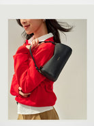 HONGU Leather Crossbody Pillow Bag in Black - On Female Model