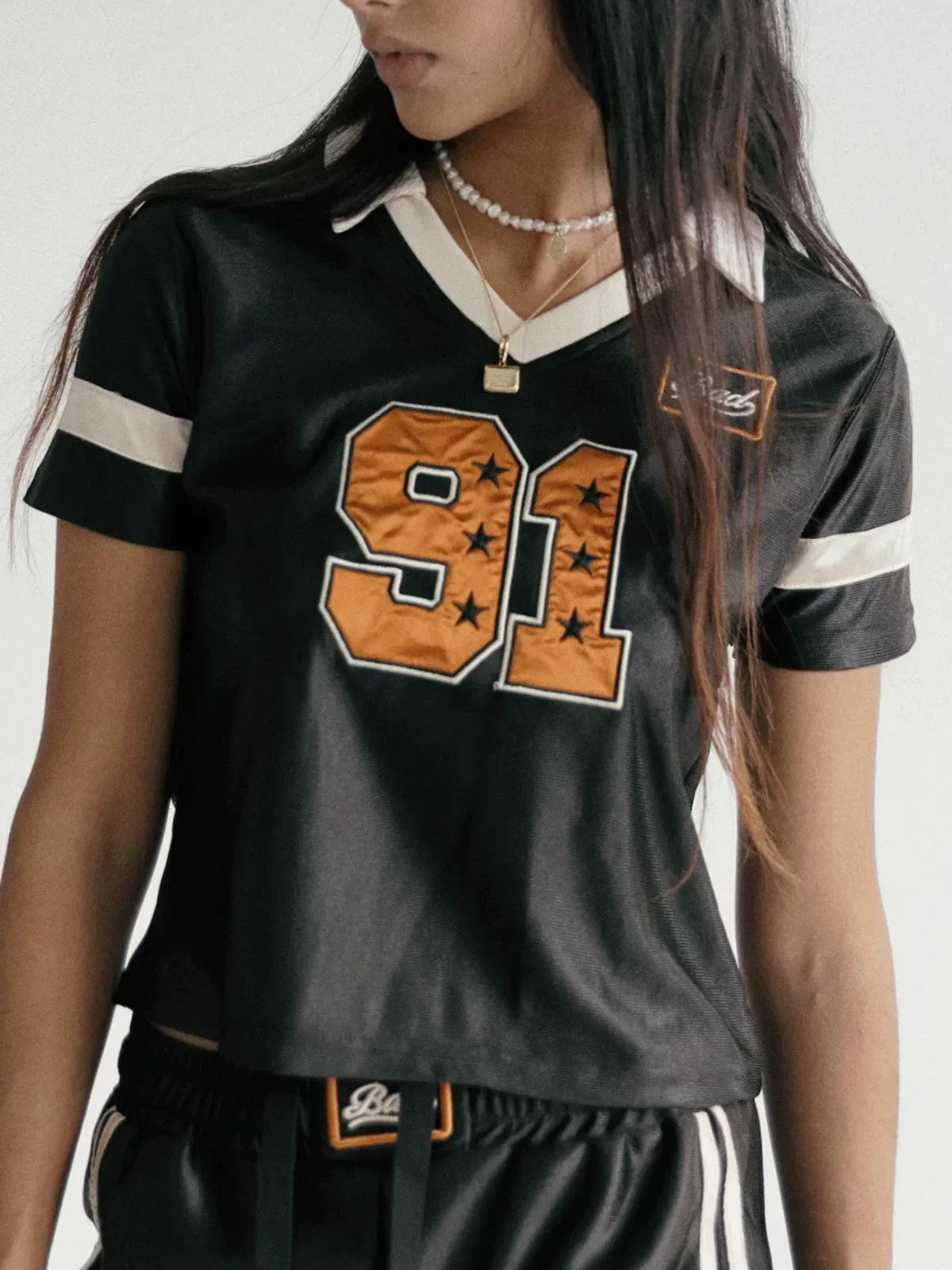 BADSEED Cropped Graphic Baseball Jersey in Black - On Female Model