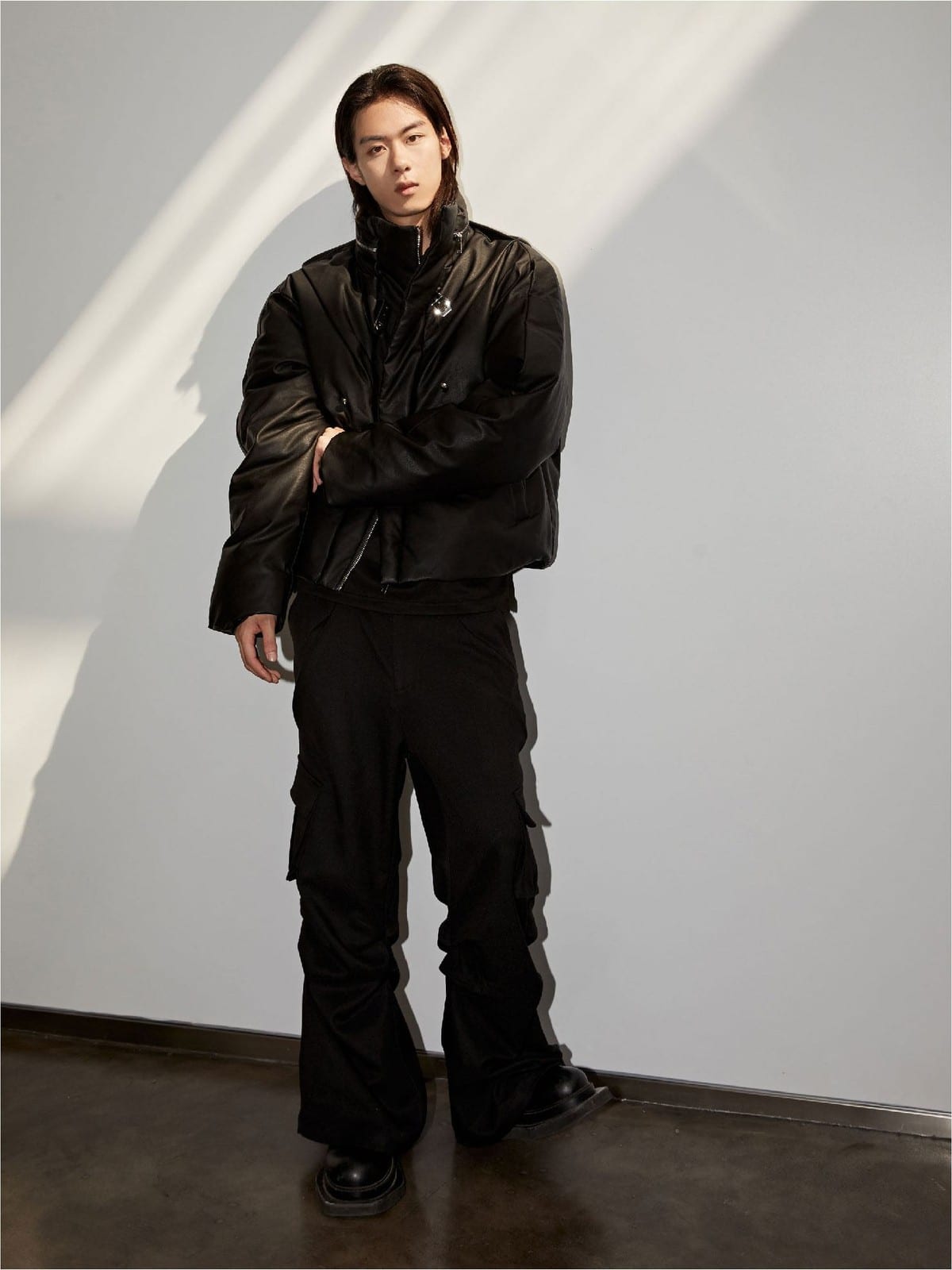 Y OFFICIAL Cropped Faux Leather Down Puffer in Black - On Male Model