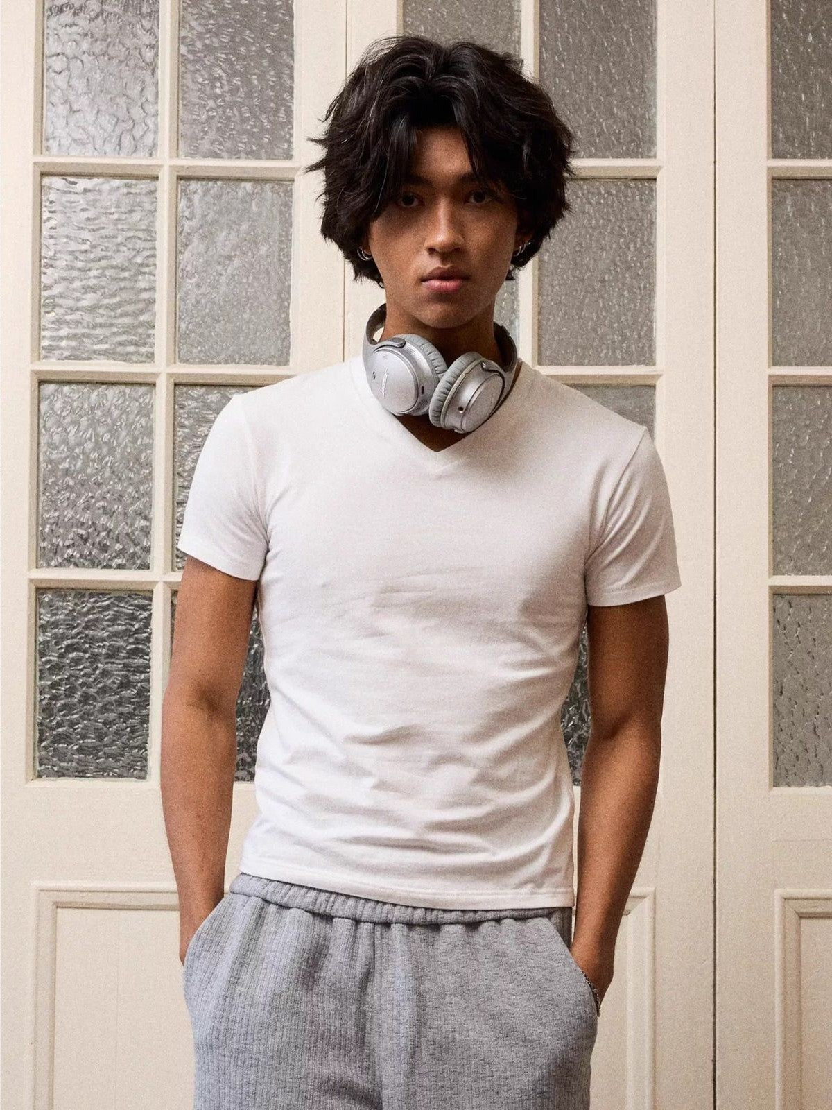 Retro 21 Anti Wrinkle V Neck T Shirt in White - On Male Model