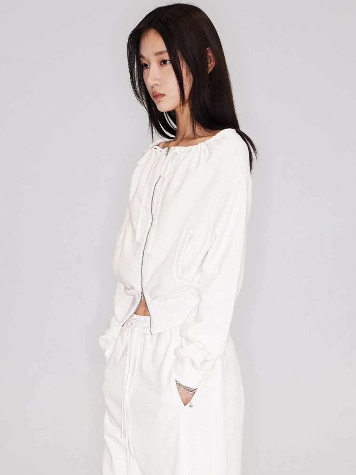 RARELY ALIKE Off Shoulder Zip Up Sweatshirt in White - On Female Model