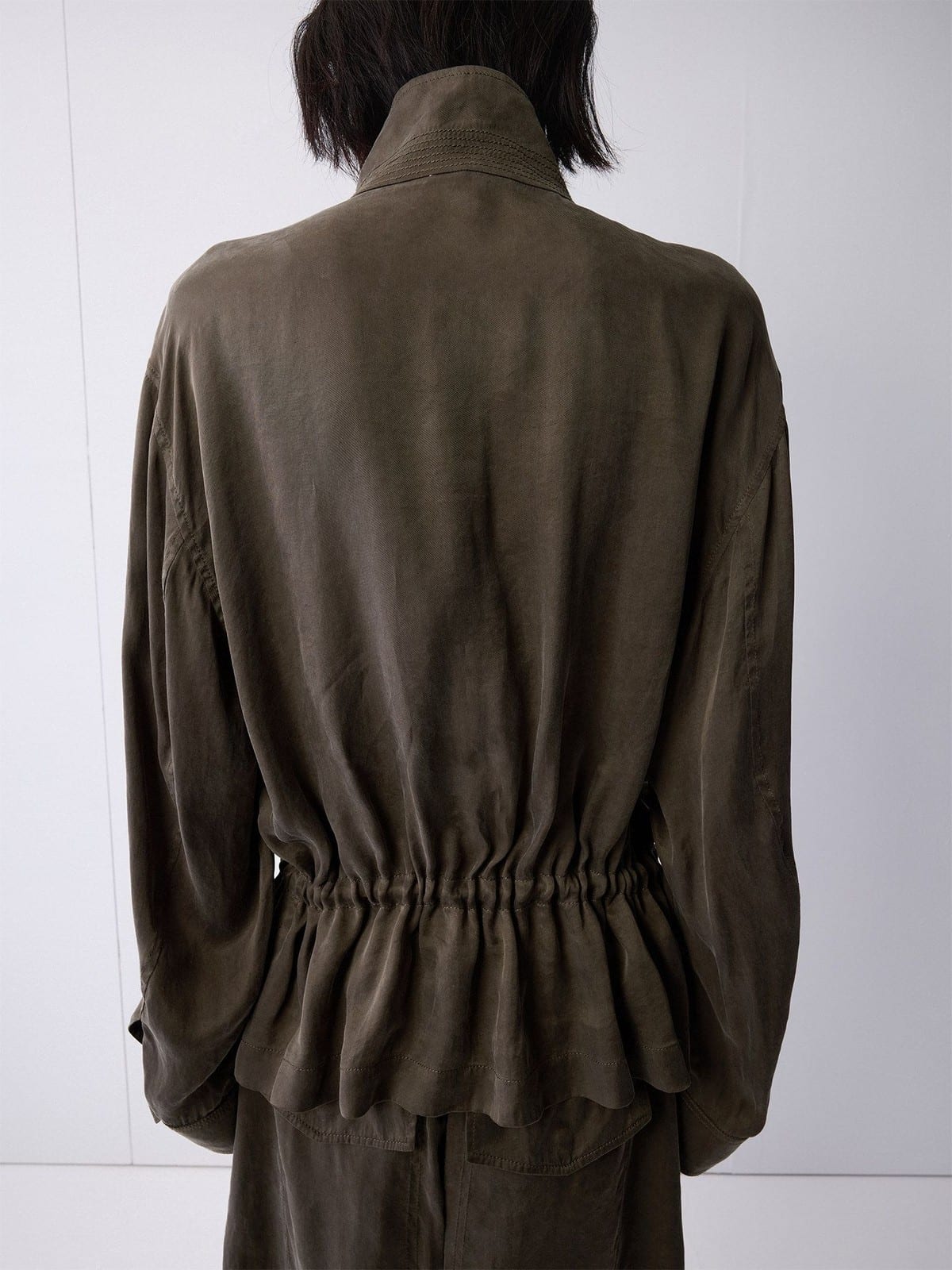 Random Piece Washed Stand Collar Peplum Jacket in Olive - On Model