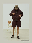 USAGE Crinkle Nylon Hooded Track Jacket in Brown - On Male Model