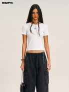 SMFK Acetate Blend Cross Graphic T Shirt in White - On Female Model