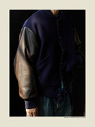 USAGE Reversible Velvet Leather Varsity Jacket in Navy Blue - On Male Model