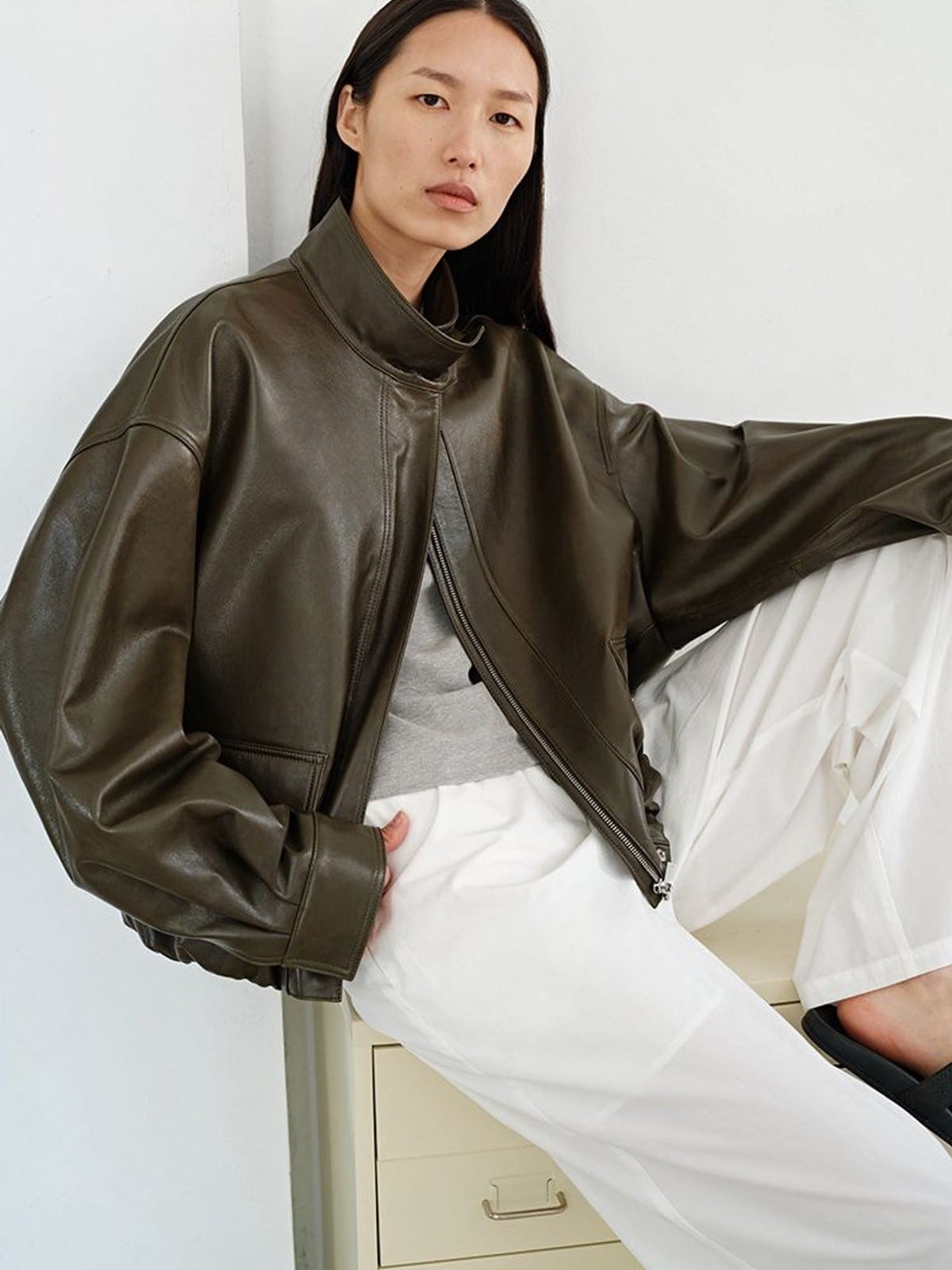 MSBEAST Oil Waxed Sheepskin Stand Collar Jacket in Olive - On Female Model