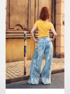 BeerBro Distressed Dirty Wash Relaxed Jeans in Blue - On Female Model