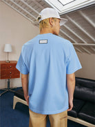 MEDM Pearl Embellished Letter Cotton T Shirt in Sky Blue - On Model