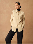 TEASEL Merino Wool Pleated Trousers in Black - On Female Model