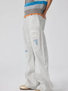 SIMPLE PROJECT Patchwork Distressed Flared Jeans in White - On Model