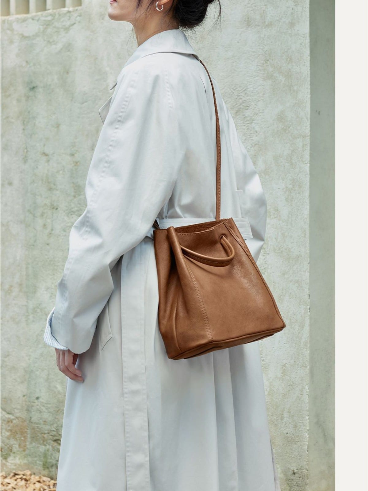 QIUZHEN Vegetable Tanned Leather Bucket Bag in Brown - On Female Model