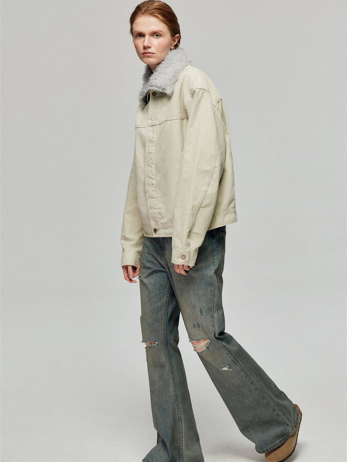 SIMPLE PROJECT Distressed Vintage Wash Flare Jeans in Blue - On Female Model