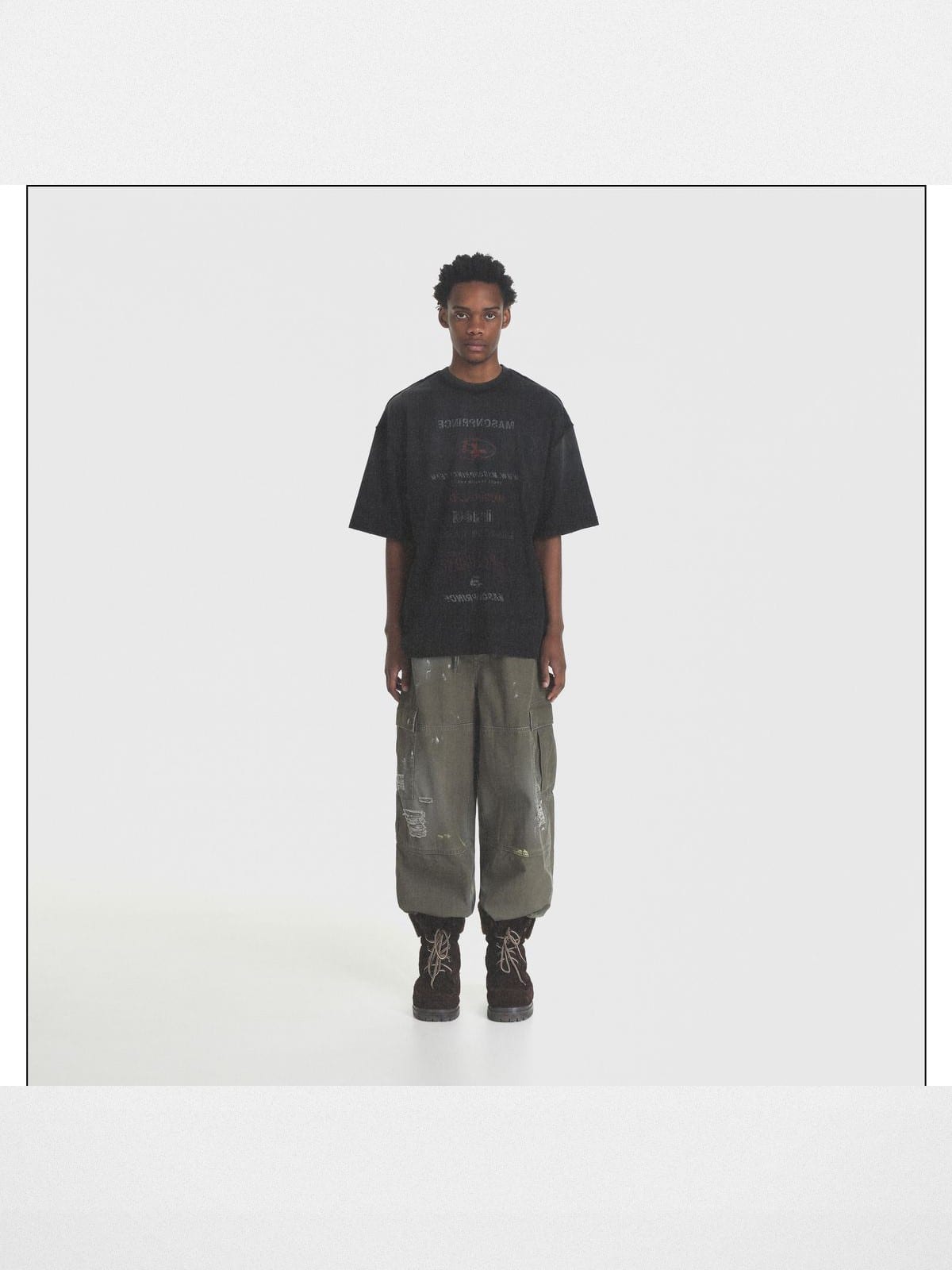 MASONPRINCE Distressed Typographic Cotton T Shirt in Black - On Male Model