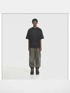 MASONPRINCE Distressed Typographic Cotton T Shirt in Black - On Male Model