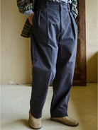 USAGE Pleated Cotton Twill Chinos in Navy Blue - On Model