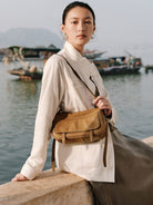 QIUZHEN Vegetable Tanned Leather Camera Bag in Beige - On Female Model