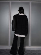 RARELY ALIKE Curved Seam Denim Flare Jeans in Black - On Model