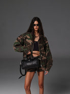 SMFK Medium Leather Cross Motif Handbag in Black - On Female Model