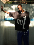 TRIANGLE PROJECT 001 Graphic V Neck Jersey Tee in Black - On Male Model