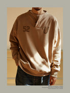 USAGE Terry Cotton Henley Sweatshirt in Beige - On Male Model