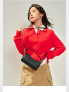 HONGU Leather Crossbody Pillow Bag in Black - On Female Model