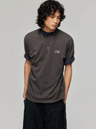 SIMPLE PROJECT Inverted Silver Logo Crewneck T Shirt in Charcoal - On Male Model
