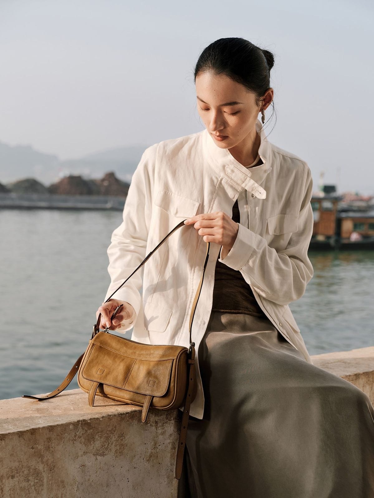 QIUZHEN Vegetable Tanned Leather Camera Bag in Beige - On Female Model