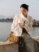 QIUZHEN Vegetable Tanned Leather Camera Bag in Beige - On Female Model