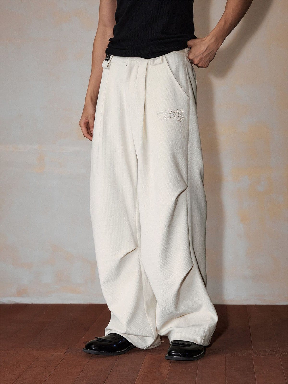 MEDM Wide Leg Parachute Cargo Pants in White - On Male Model
