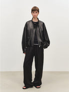 MSBEAST Oil Waxed Sheepskin Stand Collar Jacket in Black - On Female Model