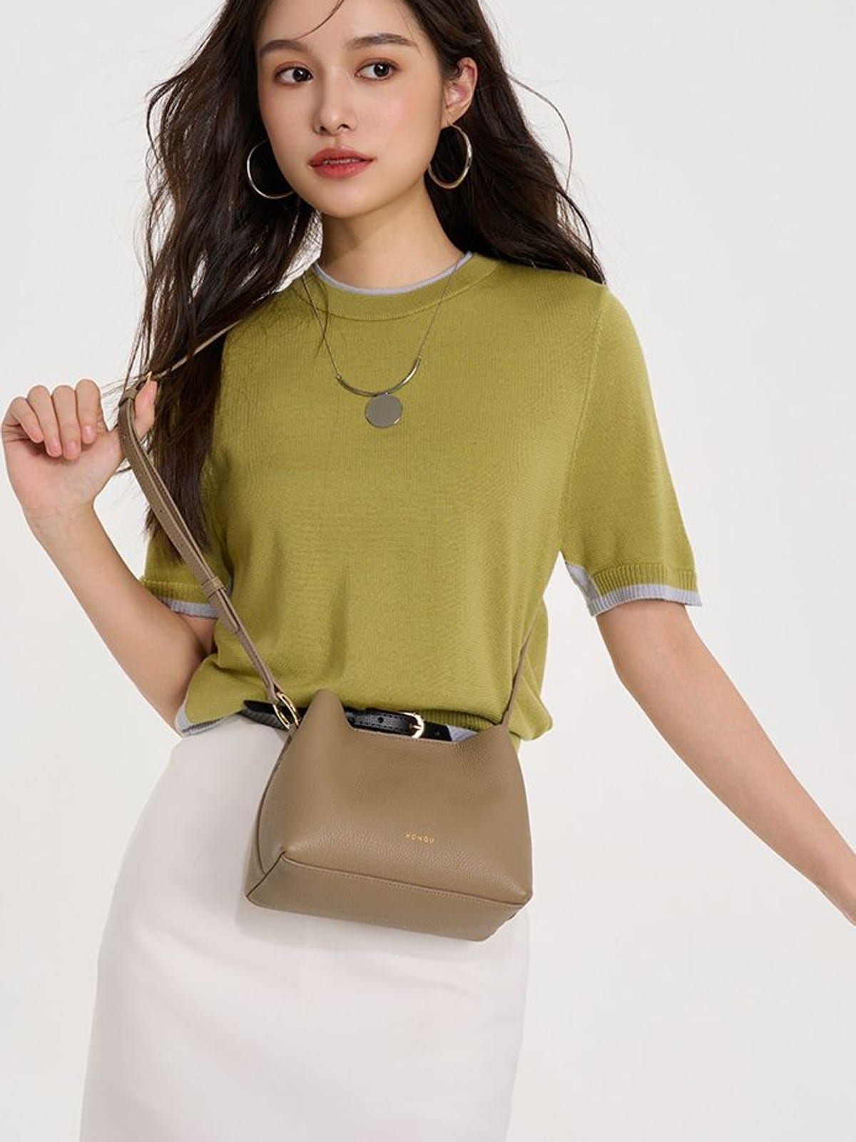 HONGU Cowhide Crossbody Bucket Bag in Taupe - On Female Model