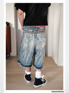 UNKNOWNWORLD Distressed Wash Baggy Shorts in Blue - On Male Model