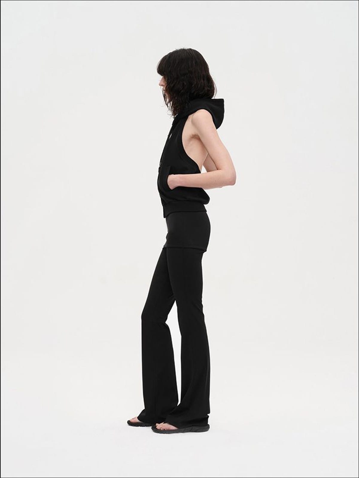 RARELY ALIKE Low Rise Layered Flared Yoga Pants in Black - On Female Model
