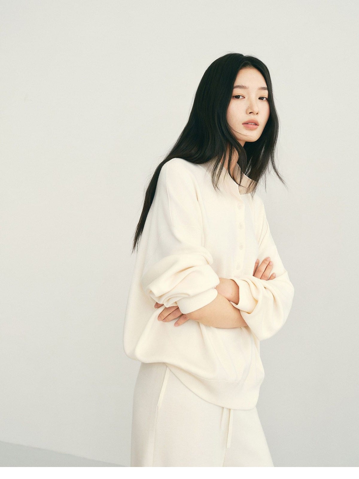 TEASEL Worsted Wool Henley Sweatshirt in Cream - On Female Model