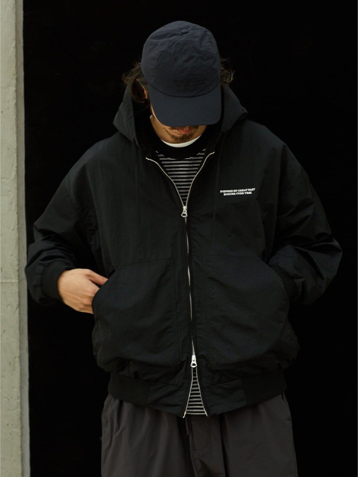 USAGE Crinkle Nylon Hooded Track Jacket in Black - On Male Model