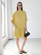 MSBEAST Oversized Acetate Satin T Shirt in Yellow - On Female Model