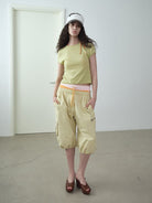 RARELY ALIKE Cropped Cotton Lantern Cargo Shorts in Beige - On Female Model