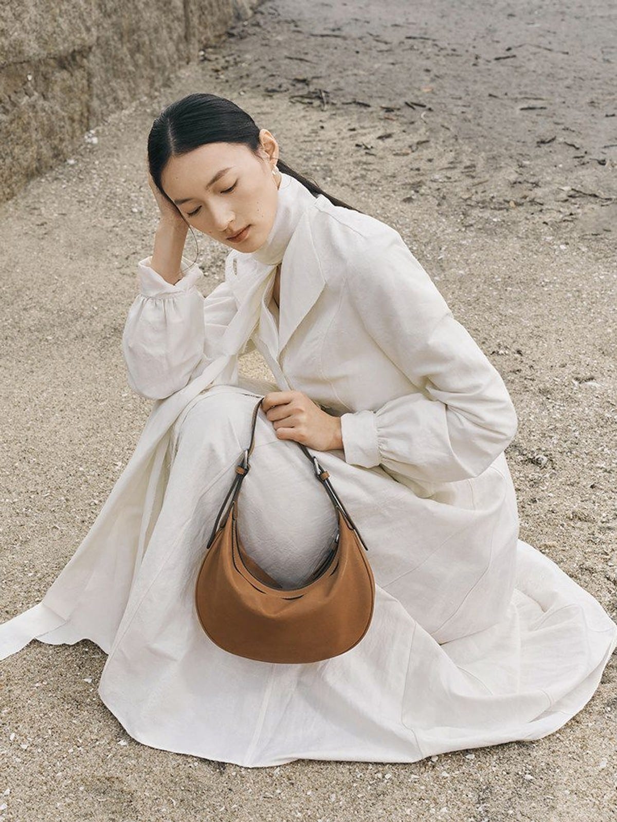 QIUZHEN Vegetable Tanned Leather Crescent Bag in Beige - On Female Model